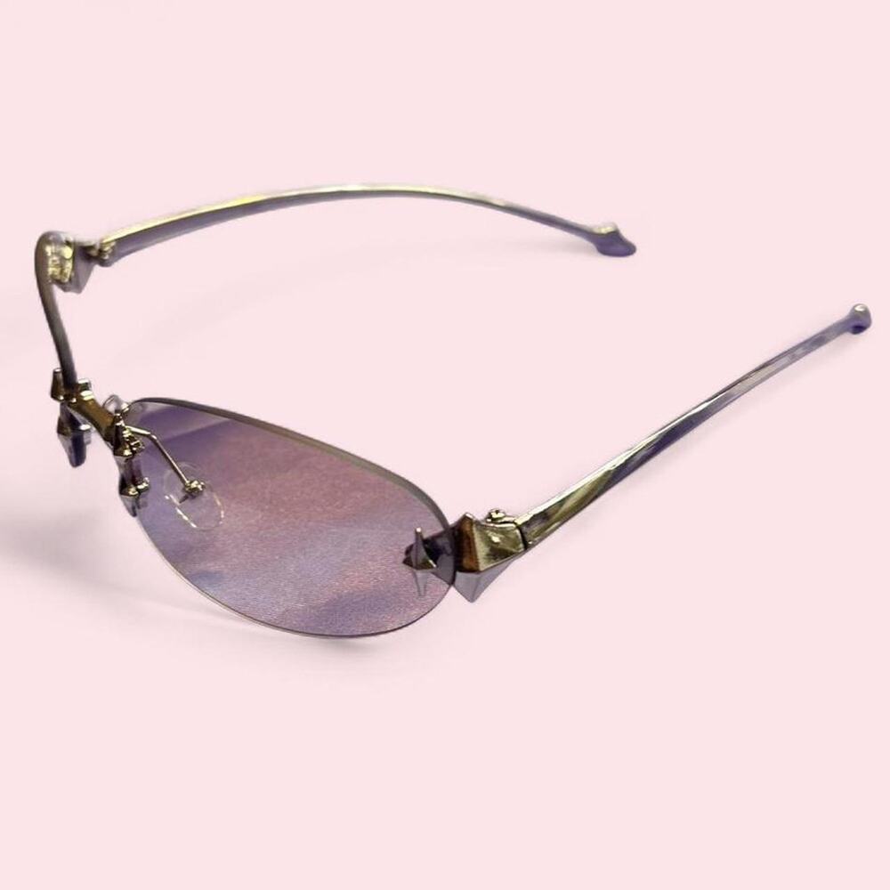 Sleek unisex rimless sunglasses with smoky tinted lenses and silver hardware